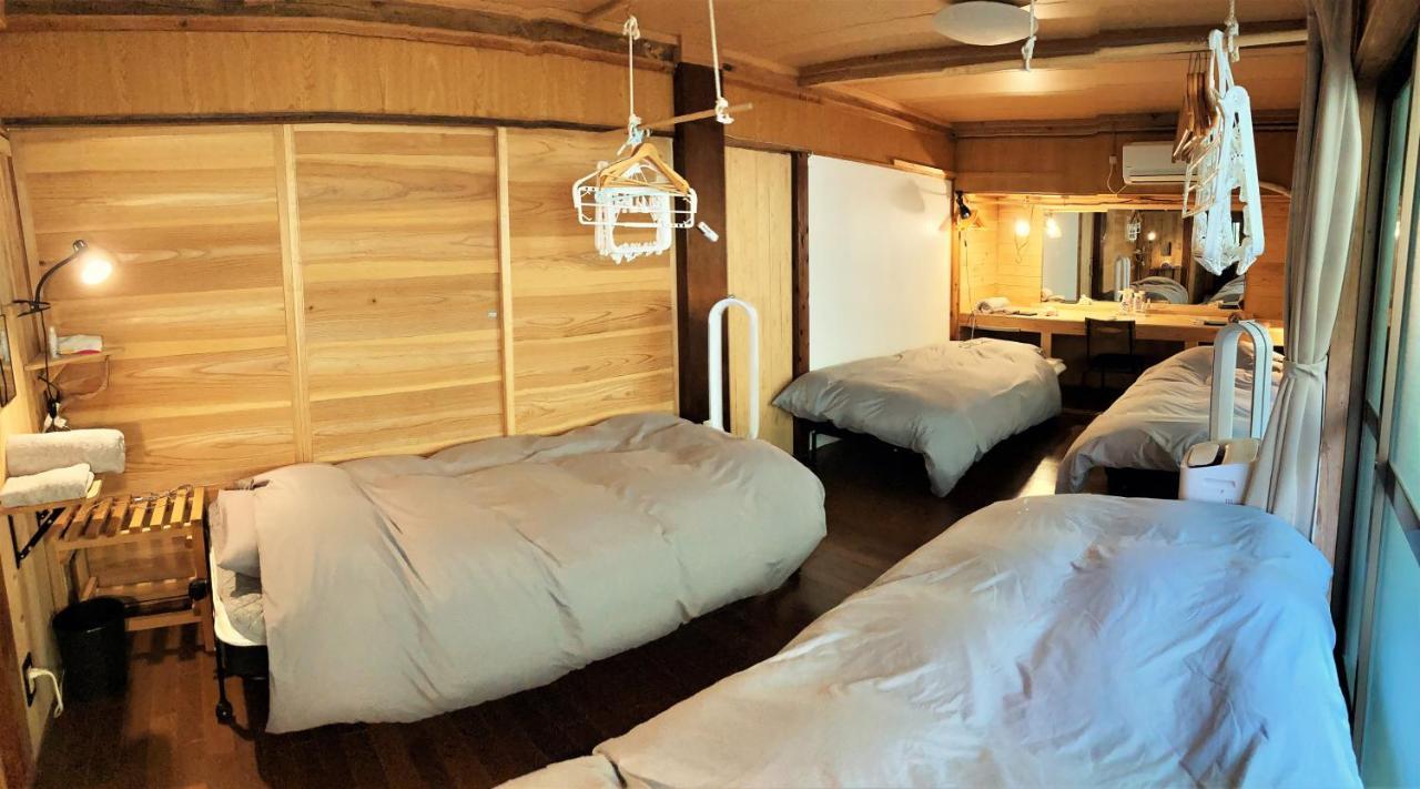 奄美ゲストハウス Hub A Nice Inn Setouchi  ภายนอก รูปภาพ